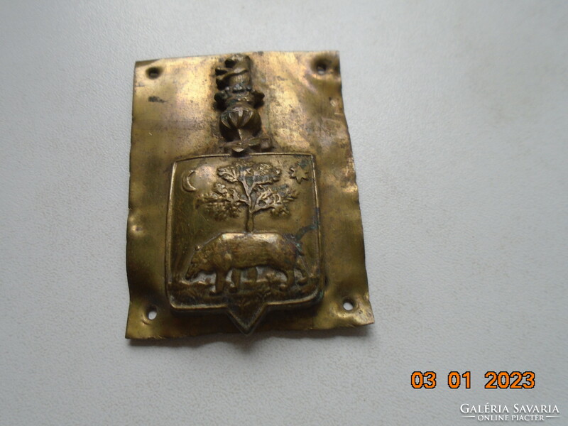 Antique copper coat of arms with bear, tree, sun, moon, bear crown elements