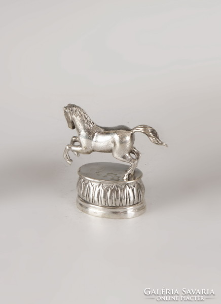 Silver trotting horse figure