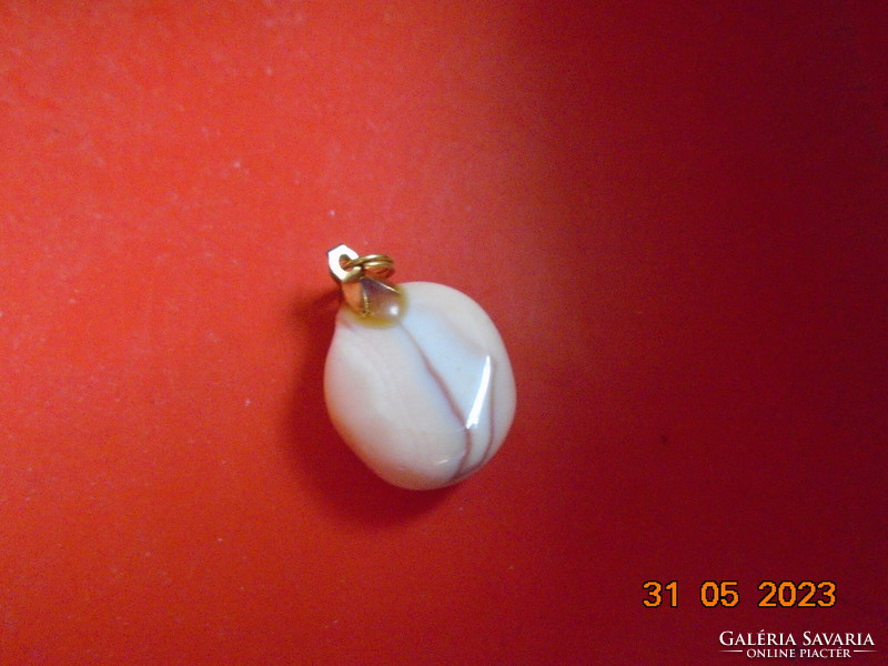 A pendant polished from a rare shell with a gold-colored hook