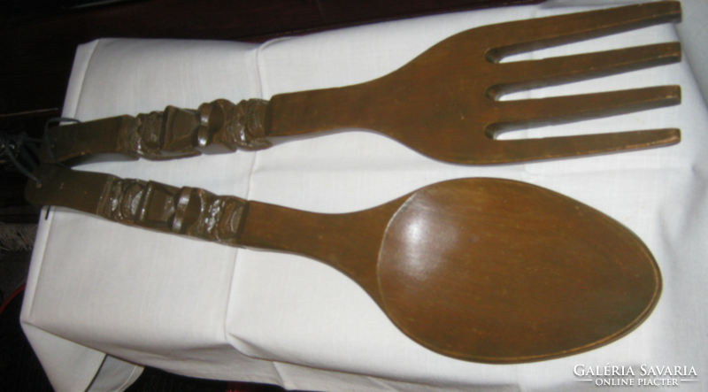 Peasant decor with giant carved wooden spoon and wooden fork