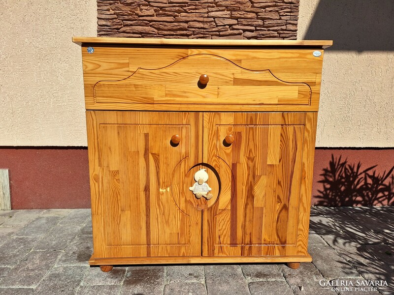 For sale: a Drewex pine children's chest of drawers with shelves and drawers, in good condition, completely made of pine.