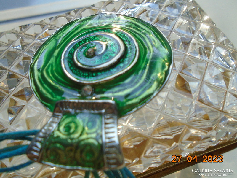 Iridescent green enamel silver-plated pendant with convex spiral, blue multi-line cord