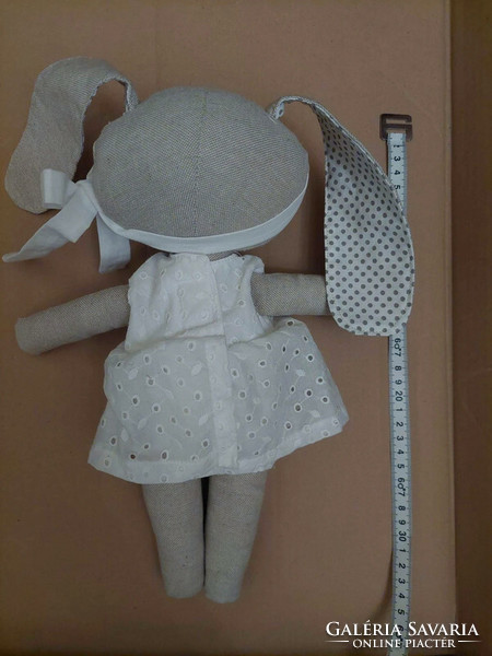 New, handmade rabbit doll made of natural materials, in white clothes