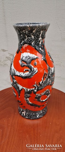 Retro industrial art ceramic vase with a grayish-white pattern on a red background
