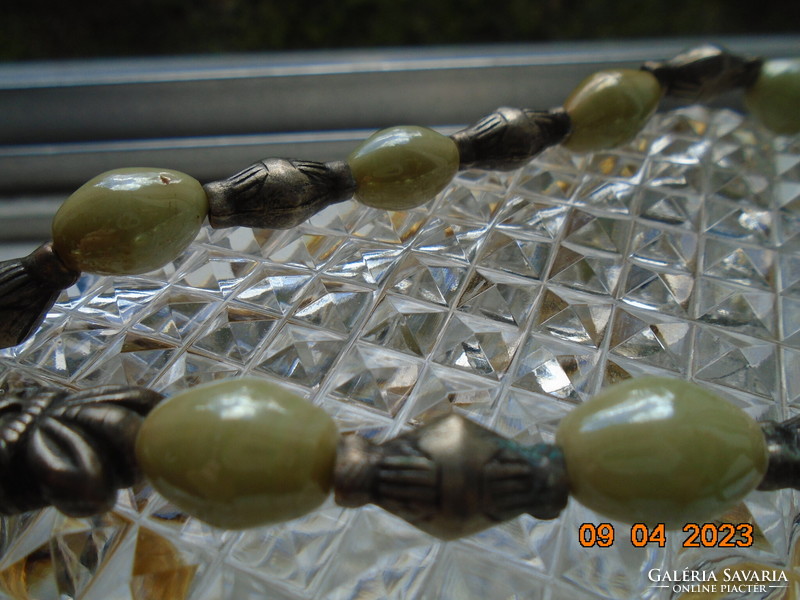 Interesting neck blue Celtic knot with gold thread cord, pale green opal glass and figurative silver beads