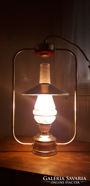 A retro electrometal hat lamp in the shape of a kerosene lamp in mint condition