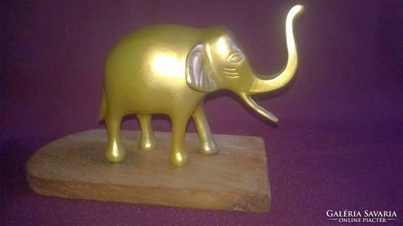 Metal elephant on a wooden base - shelf decoration