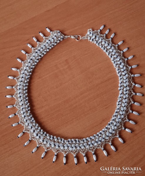White, silver-centered transparent pearl necklace