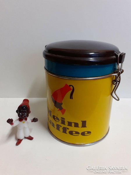 Nice condition julus meinl coffee plate box with a vinyl lid and a small nutmeg figure
