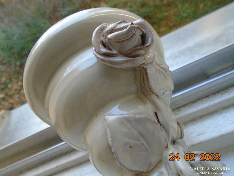 Handmade ceramic vase with plastic roses and steps