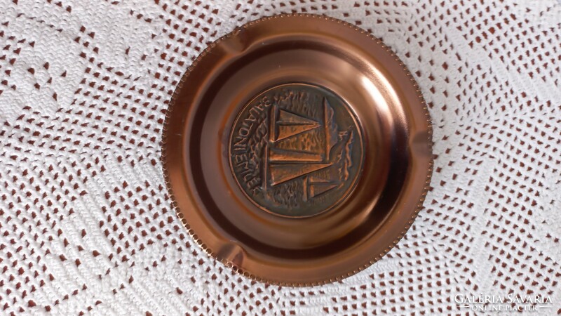 Old red copper(?) embossed ashtray with the inscription 