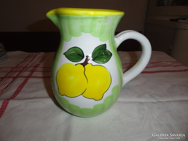 Green ceramic jug with lemon pattern