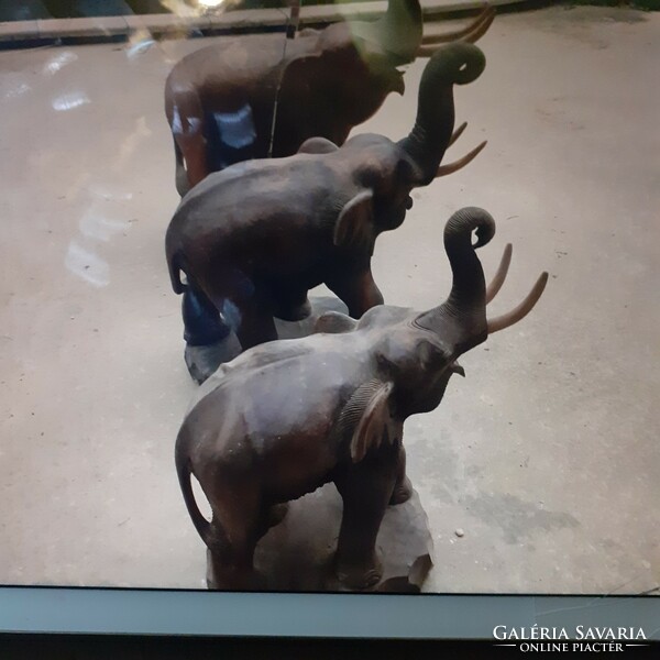 3 giant elephants made of tropical wood.