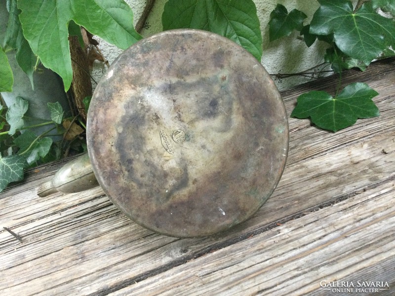 Old teapot with wooden tongs