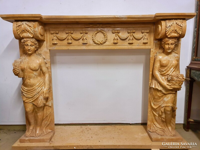 Marble fireplace in the shape of a woman and a man
