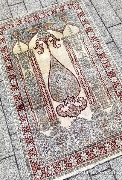Hand-knotted silk carpet is negotiable
