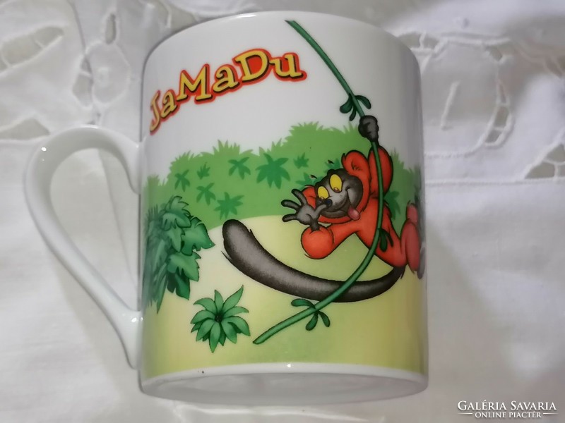 Jamadu rare porcelain mug with a monkey face, in a display case