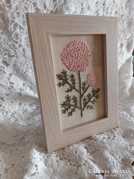 Floral embroidered image with a vintage feel.