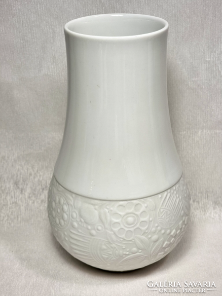 Rosenthal white biscuit porcelain vase, björn wiinblad design, with a floral embossed pattern on the bottom.