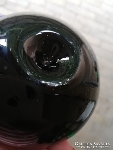Black tomato in glass leaf weight