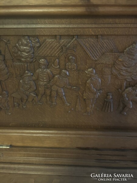 Richly carved lancet cupboard