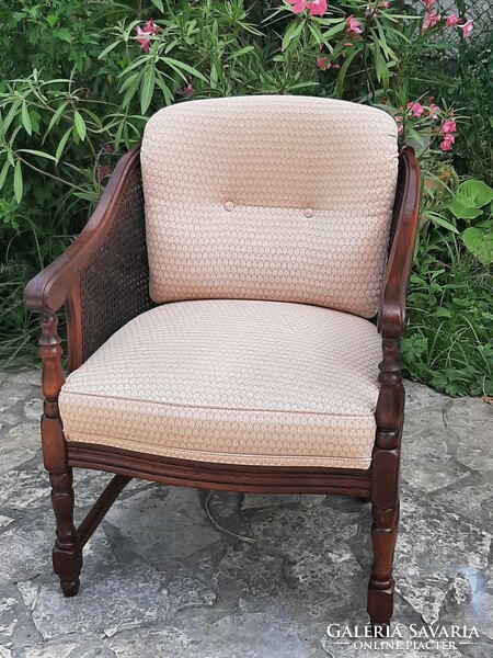 A round caned armchair in good condition