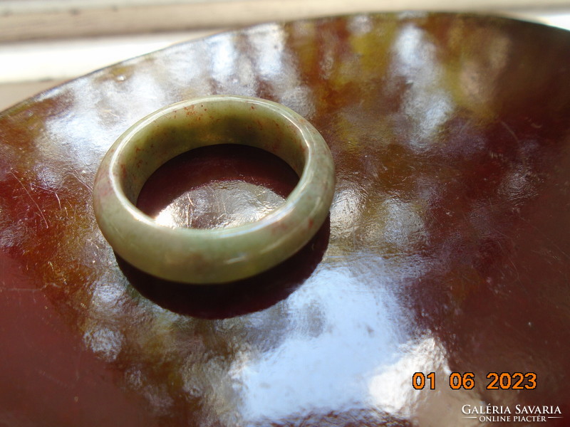 Jade ring with inclusions