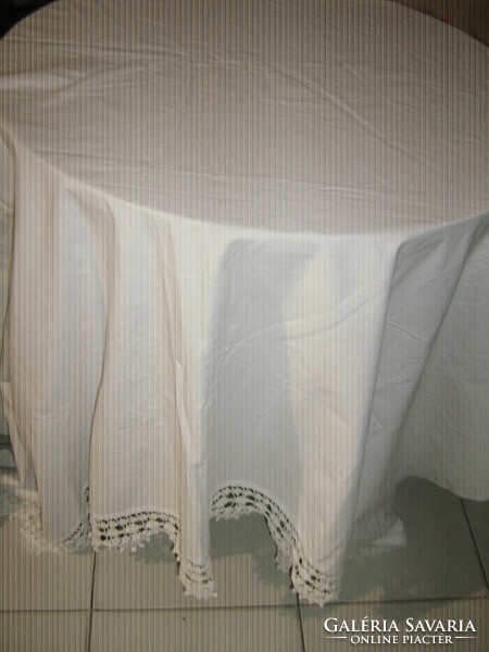 Beautiful vintage hand-crocheted white curtain with a lace bottom