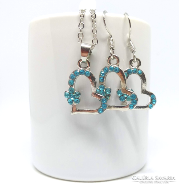 Silver necklace and earrings set with heart pendant decorated with blue crystals