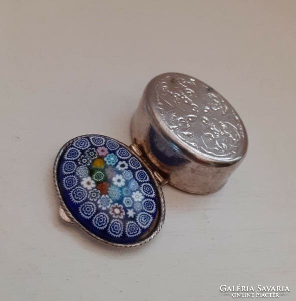 Silver-colored chiseled medicinal jewelry box with millefiori glass decoration on top