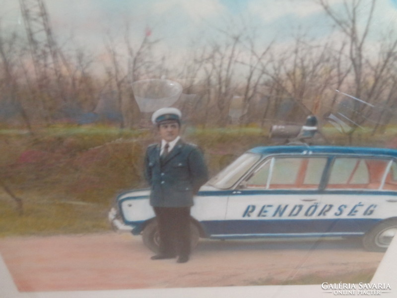 Police officer in front of a service vehicle, ca. 1970
