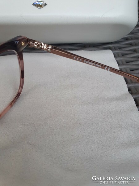 Eyeglass frame with swarovski crystals in its own case, new, unused, undamaged.