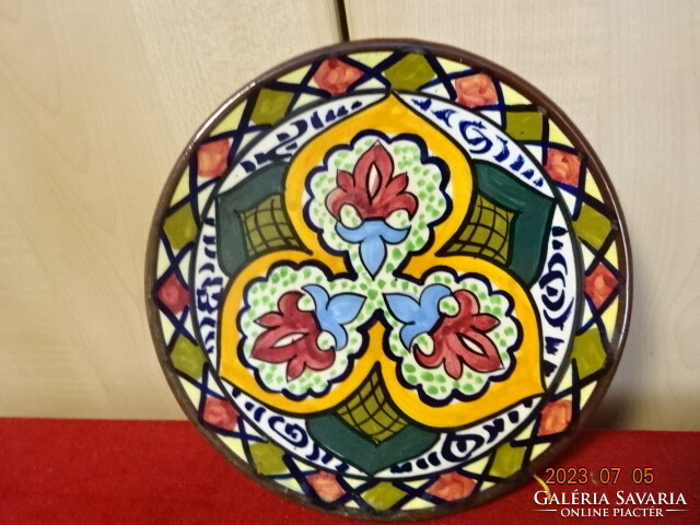 Hand-painted glazed ceramic wall plate with a folk motif, diameter 20 cm. Jokai.