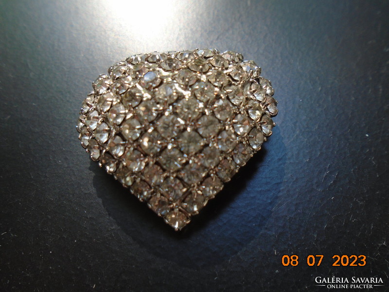 A heart pendant made of polished stones in a silver-plated socket with a hanger or brooch