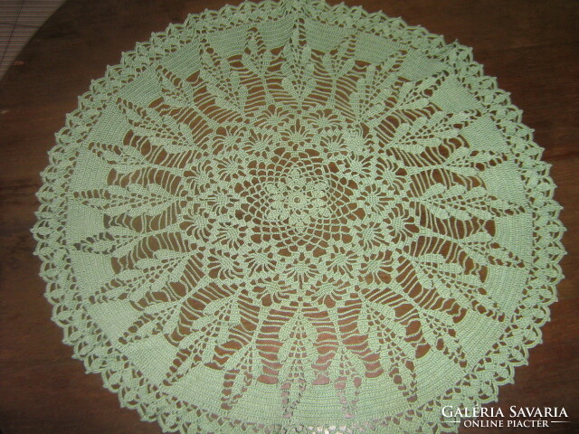 Beautiful green hand-crocheted round antique lace tablecloth