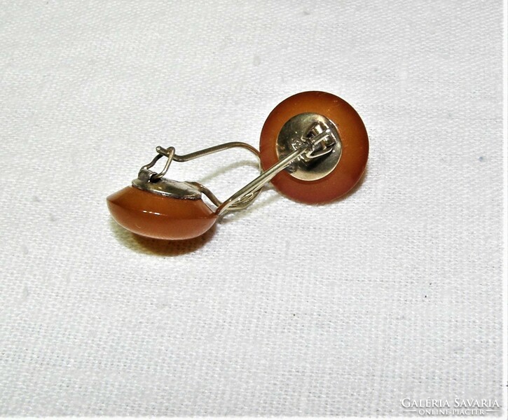 A pair of amber stone earrings in a gold-plated silver socket