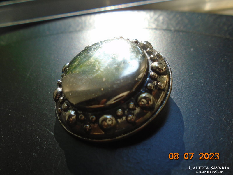 Silver-plated pendant decorated with convex pearls