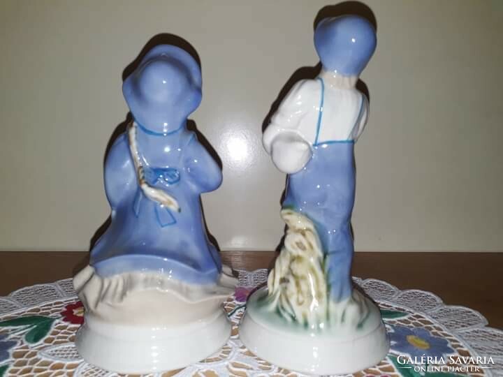 Apulum porcelain figurines in display case, 15.5cm and 17.5cm tall. Together, 7000 plus postage.