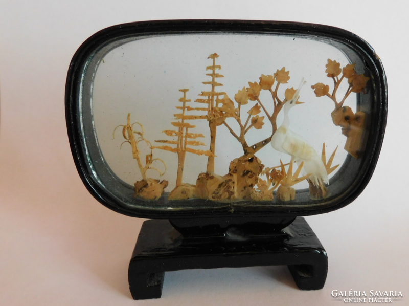 Miniature vintage diorama with white wading bird