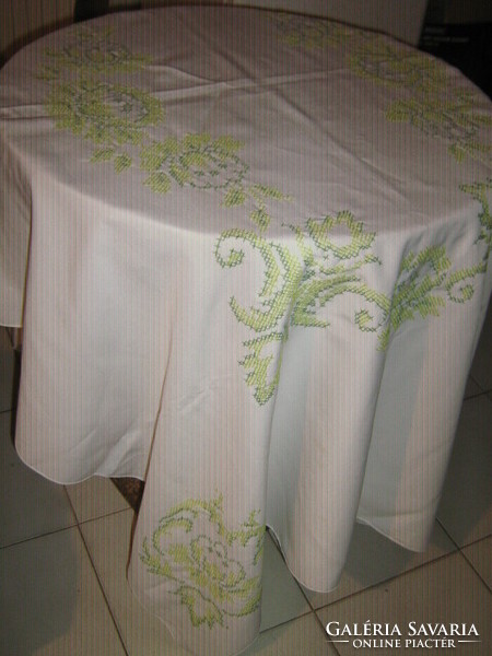 Beautiful cross-stitch hand-embroidered tablecloth with a yellow green baroque pattern