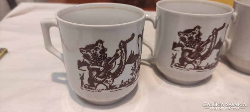 Russian porcelain mugs with fairy tale characters.