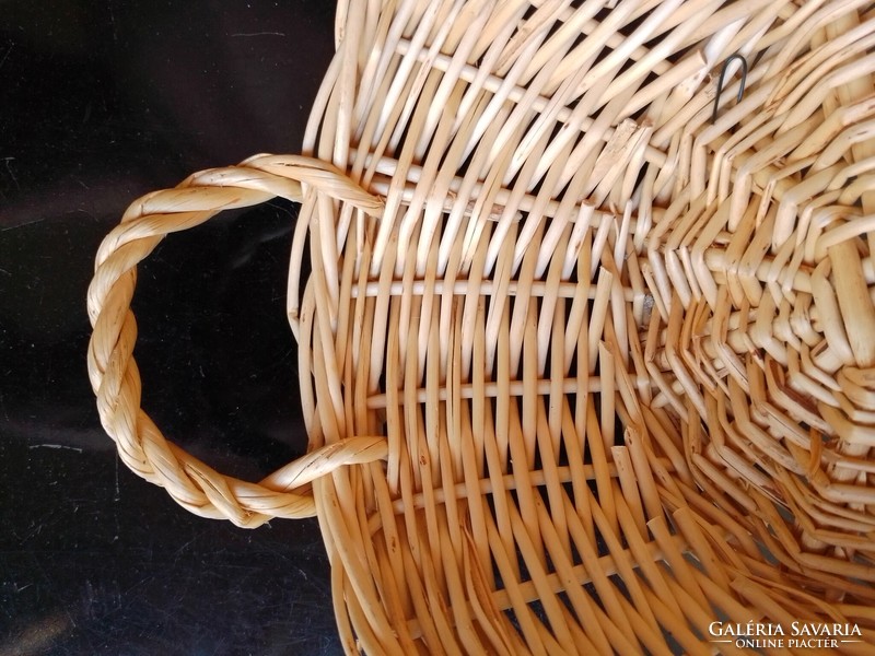 Old hand-woven cane fruit and bread storage basket with ears