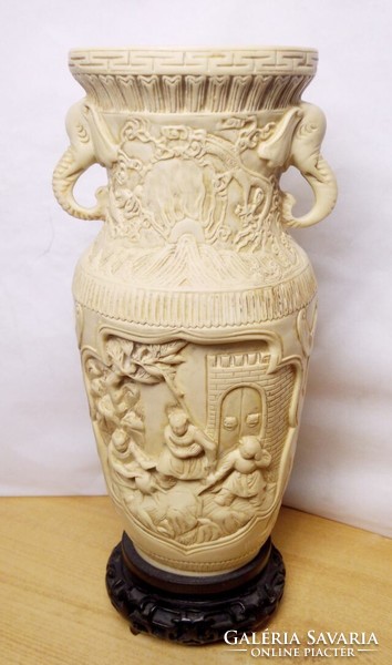 A relief vase with elephant head ears and baroque relief scenes is a unique work of art from china