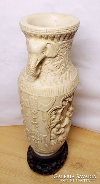 A relief vase with elephant head ears and baroque relief scenes is a unique work of art from china