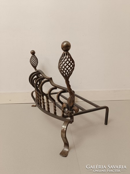 Antique wrought iron stove ember holder in front of the fireplace 909 7508