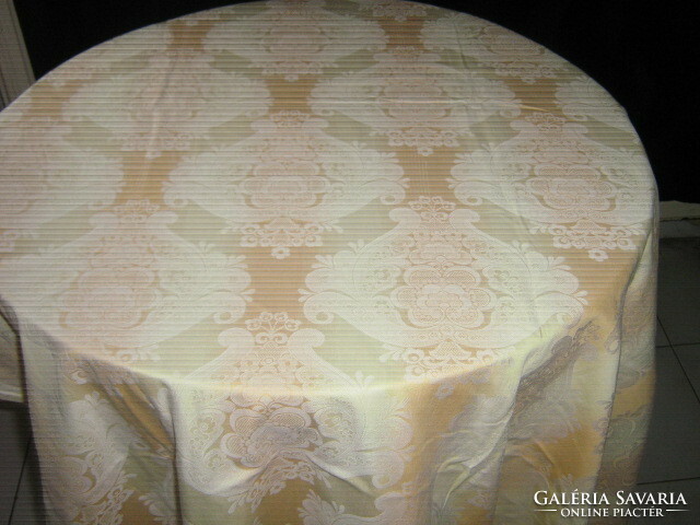 Beautifully patterned damask tablecloth with a pastel color combination