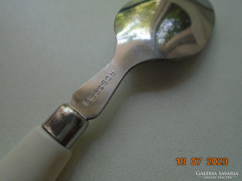 Stainless steel children's spoon marked with a colored alphabetic handle