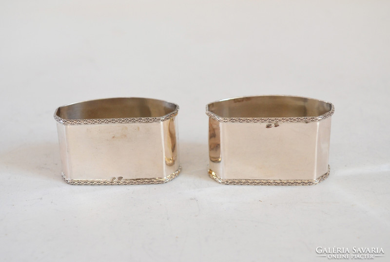 Pair of silver napkin rings, oval shape. Art deco style monogrammed nf with gold diss