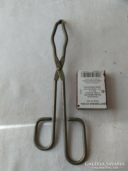 Medical instrument surgical? Tool clamps or tweezers or something like that...