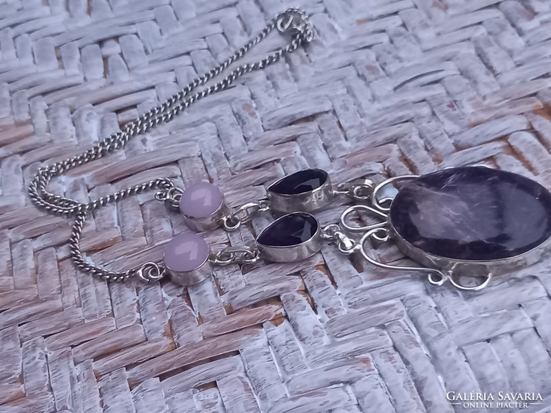 Silver necklaces decorated with rose quartz amethyst and charoite stones